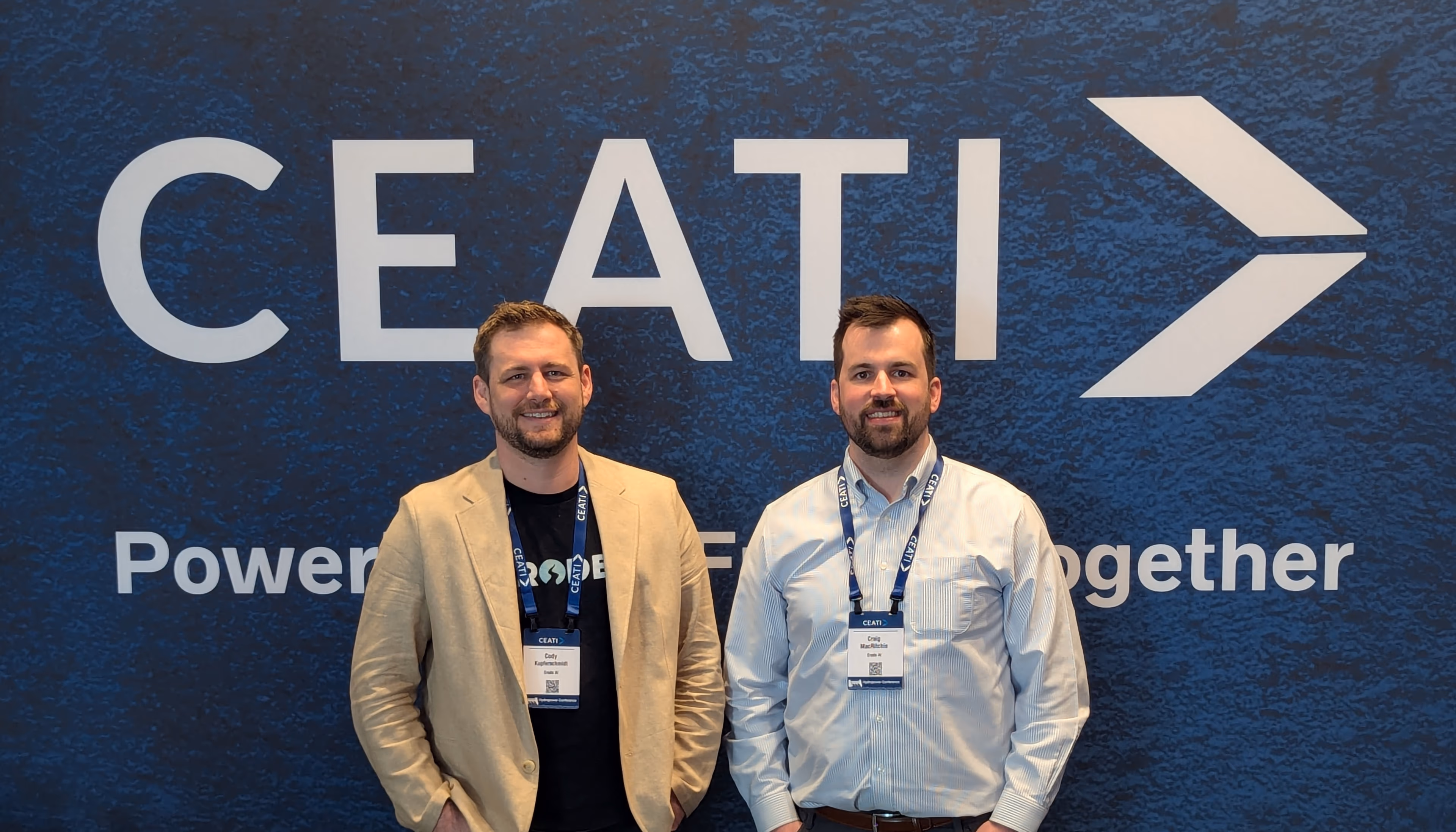 Erode AI co-founders Cody Kupferschmidt and Craig MacRitchie in front of the CEATI banner at the 2026 Hydropower Conference