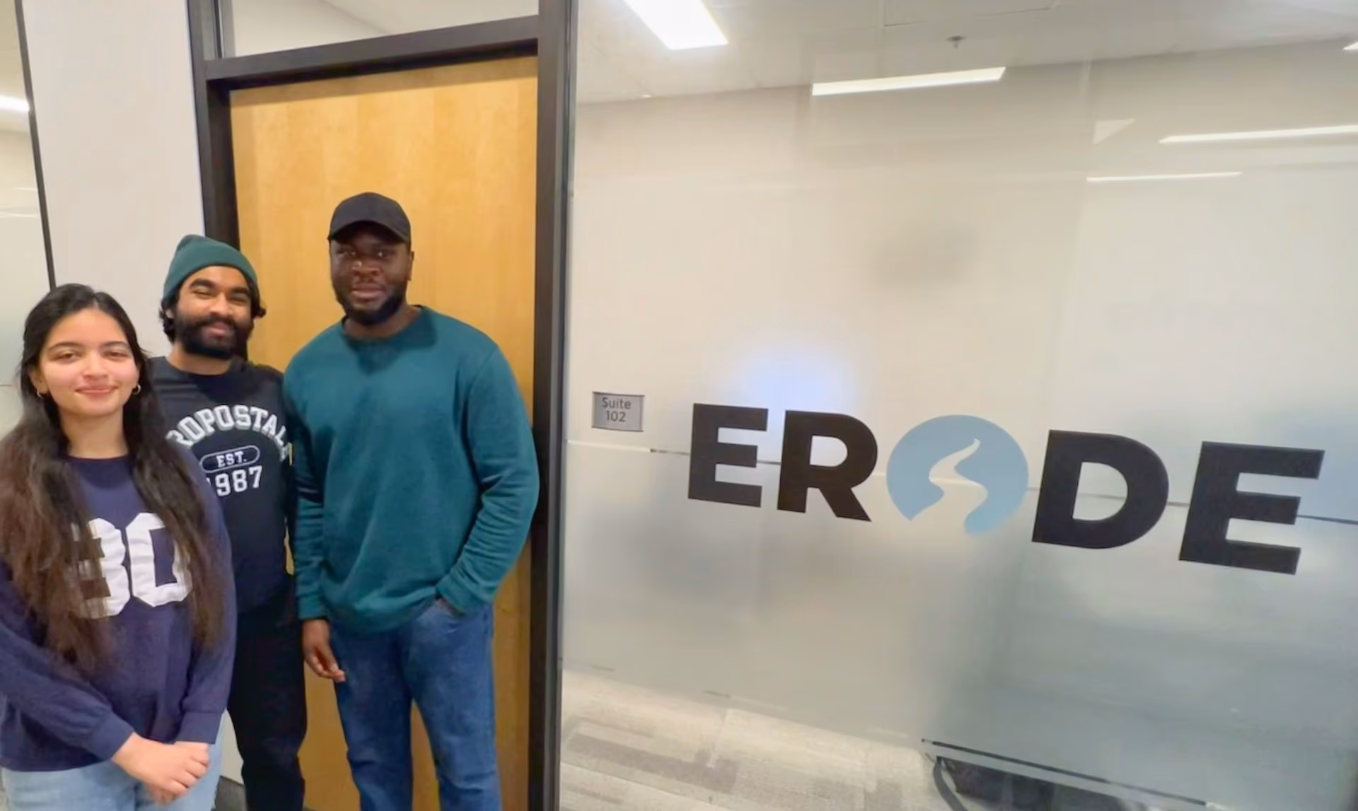New Erode AI team members standing next to the Erode sign outside the company’s Charlottetown, PEI office